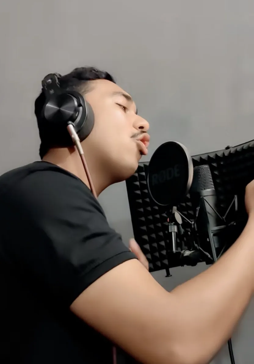 Vocalist recording into a RODE microphone at Star Productions